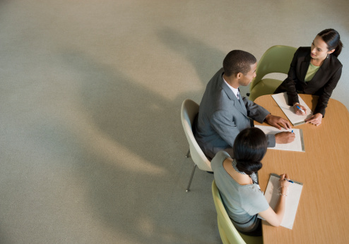 office workers at meeting table