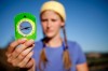 Woman using a compass in the outdoors.