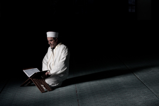 Man reading Religious Book