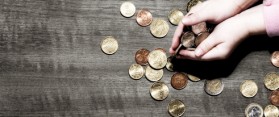 Child's hands holding coins