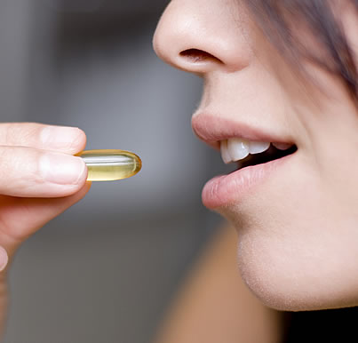 A girl taking Vitamin Supplement