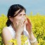 Women sneezing due to allergy