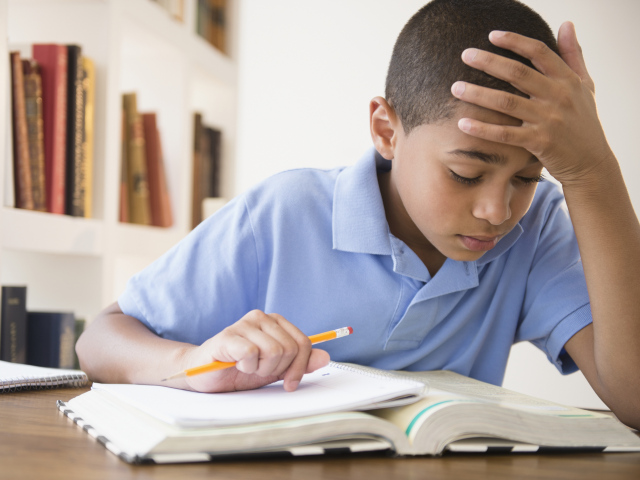 Hispanic boy doing homework