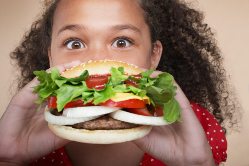 Girl eating Hamburger