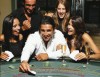 Young people playing card game in casino