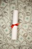 Diploma lying on money