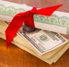 Close up of diploma and banknotes