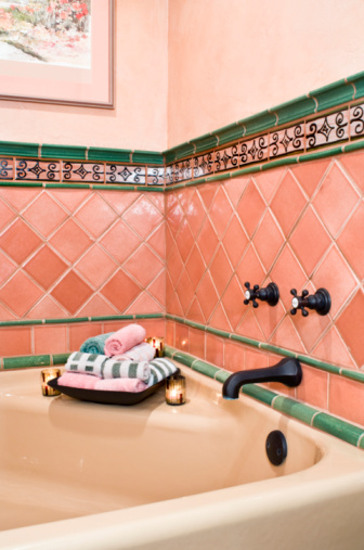 Pink and Green Tile Surrounding Bathtub