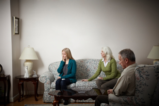 Parents telling daughter of their divorce.