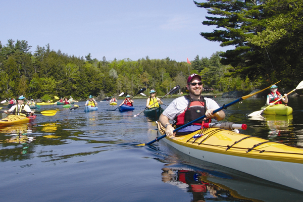 participants raise money and paddle to support the summer camp