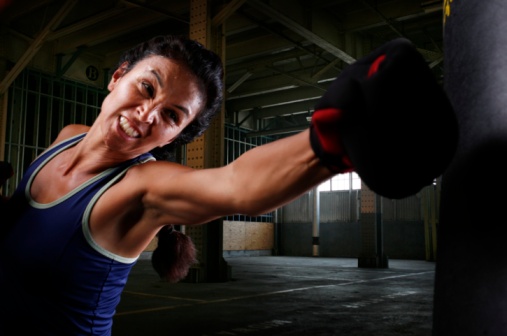 Female Boxer Throwing a Jab in Boxing