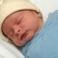 Sleeping Newborn Baby in Miracle Blanket