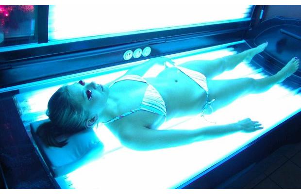 Girl Using a Tanning Bed
