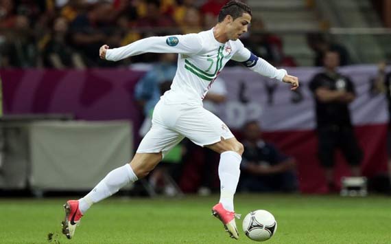 Cristiano Ronaldo running with a soccer ball