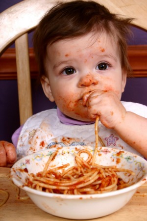 Baby with stains on his clothes