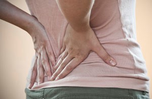 Woman in back pain
