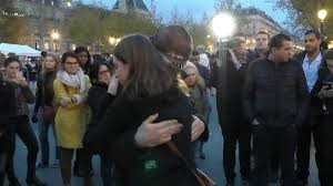 muslim man in Paris gets hugs